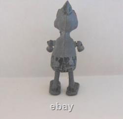 Vintage metal robot figure. Manual walking. 2-1/2 tall. Very Unusual